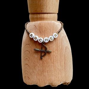 Taylor Swift Eras Tour homemade stretchy friendship bracelet & charm The Archer